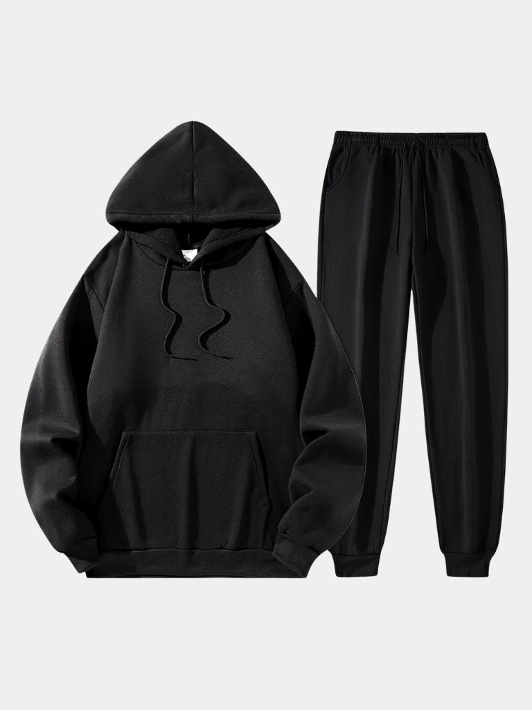 Black oversized pullover hoodie and jogger set, flat lay