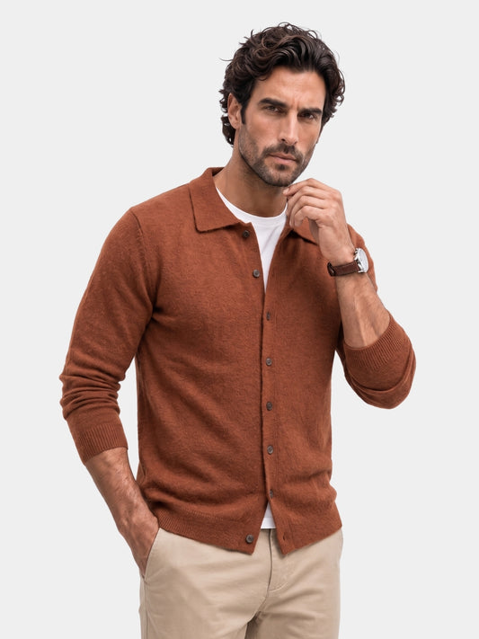Man wearing the rust cashmere polo collar cardigan over a white tee