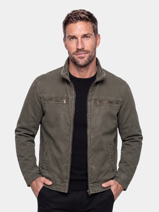 Man wearing the Valmont olive field jacket by Cross & Crown over a black tee