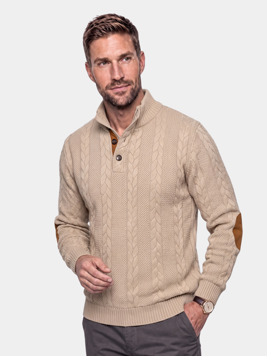 Cross & Crown man wearing a beige cable knit sweater with snap collar