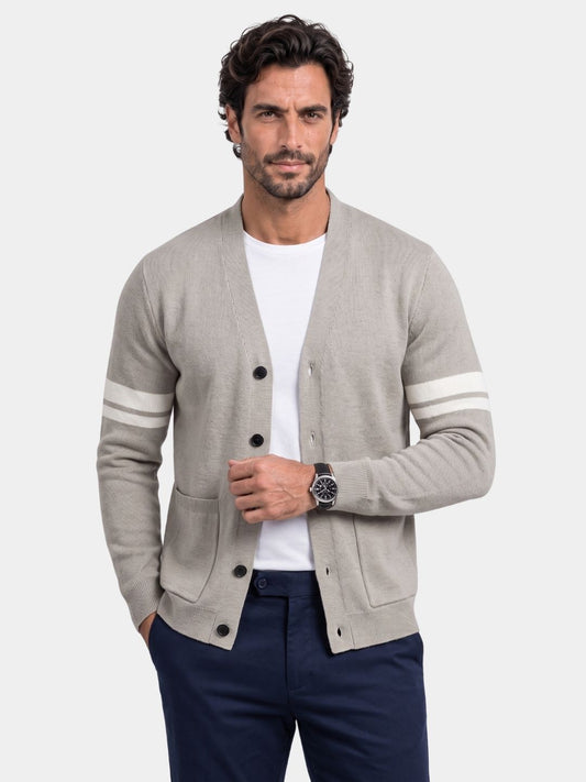 Man wearing the light gray Duke cardigan with contrast sleeve stripes