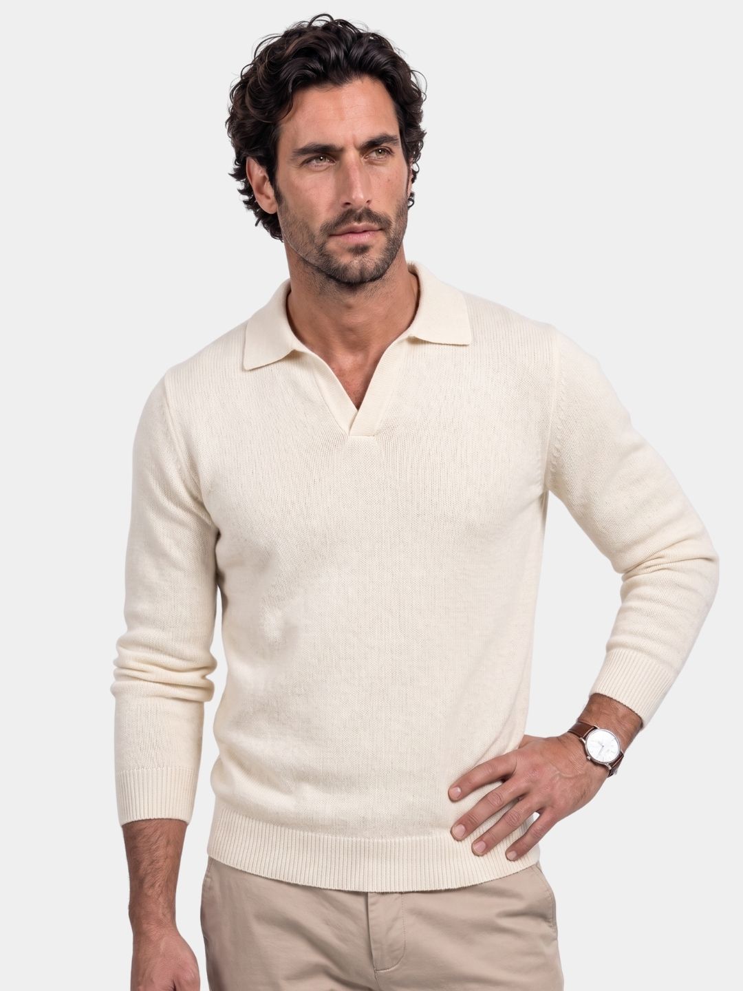 Man wearing an ivory V-neck polo pullover sweater