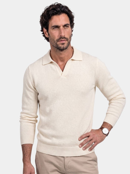 Man wearing an ivory V-neck polo pullover sweater