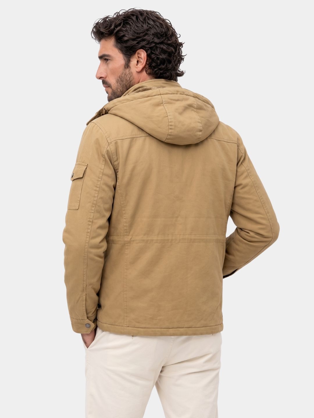 Back view of the man wearing the khaki hooded jacket