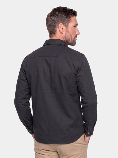 Back view of the black flannel-lined snap jacket