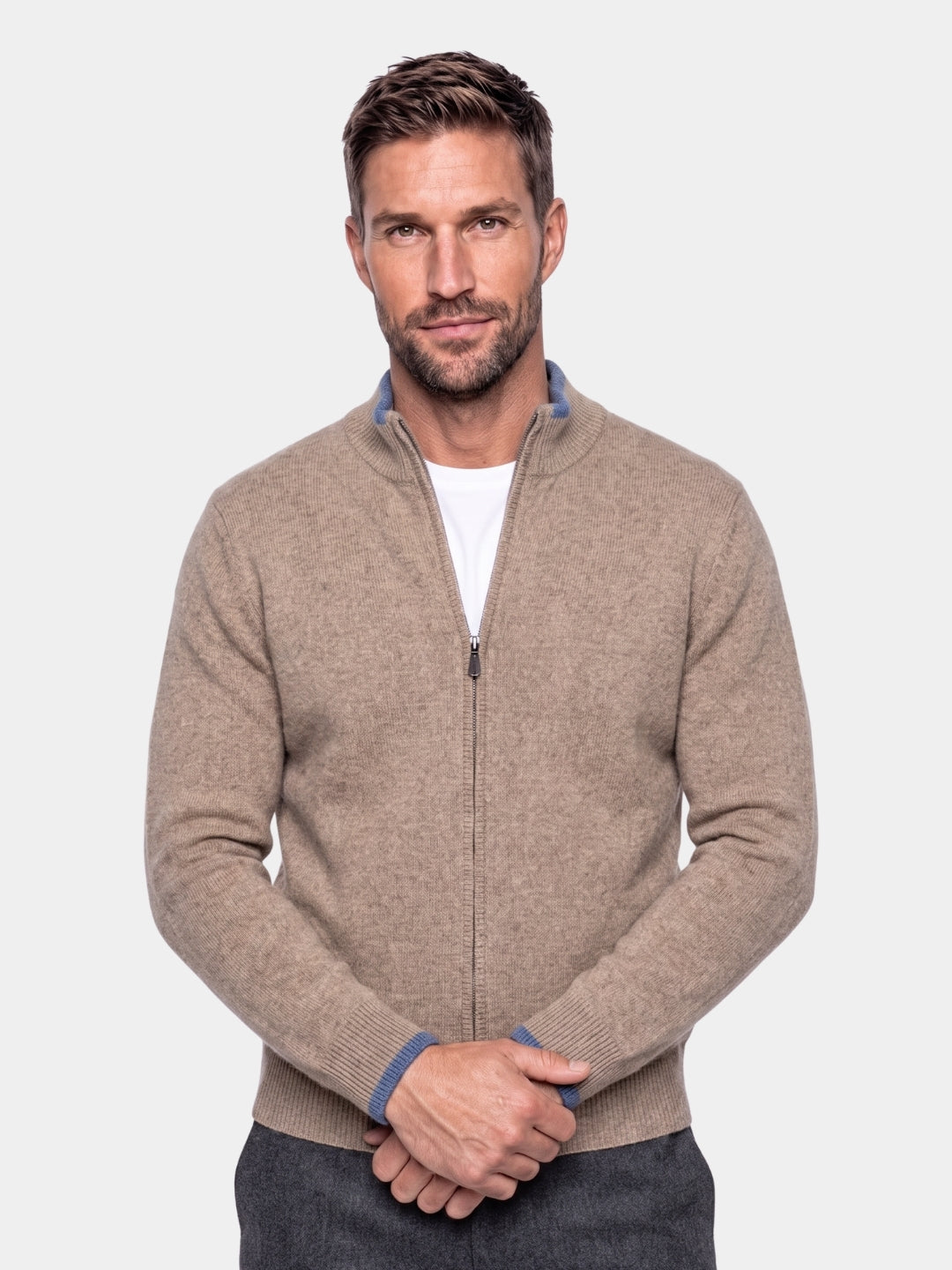 Man wearing a khaki zip-front cashmere jacket with contrast trim collar