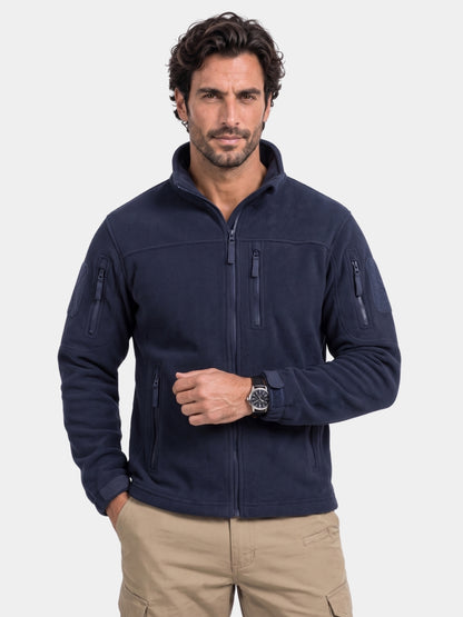 Cross & Crown man wearing the navy utility jacket with hands in the pockets