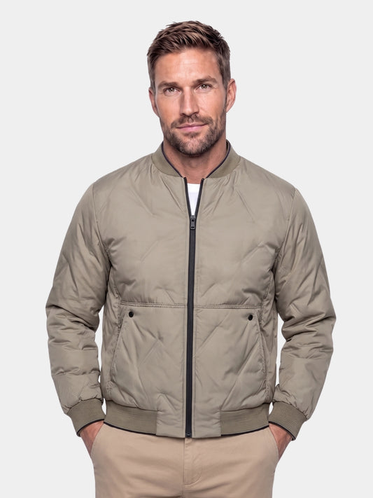 Man wearing khaki Savoy quilted bomber jacket, front view, Cross & Crown