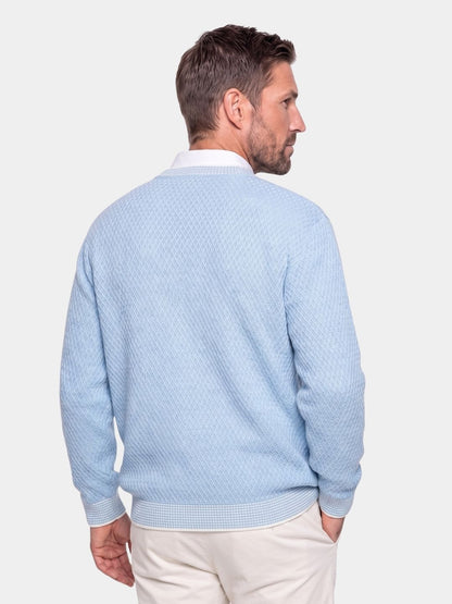Back view of the light blue textured cashmere crew neck sweater