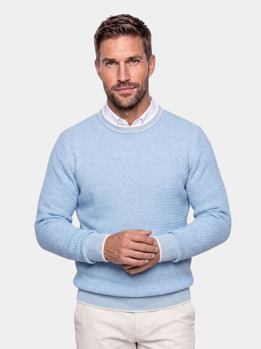 Man wearing the light blue textured cashmere crew neck sweater