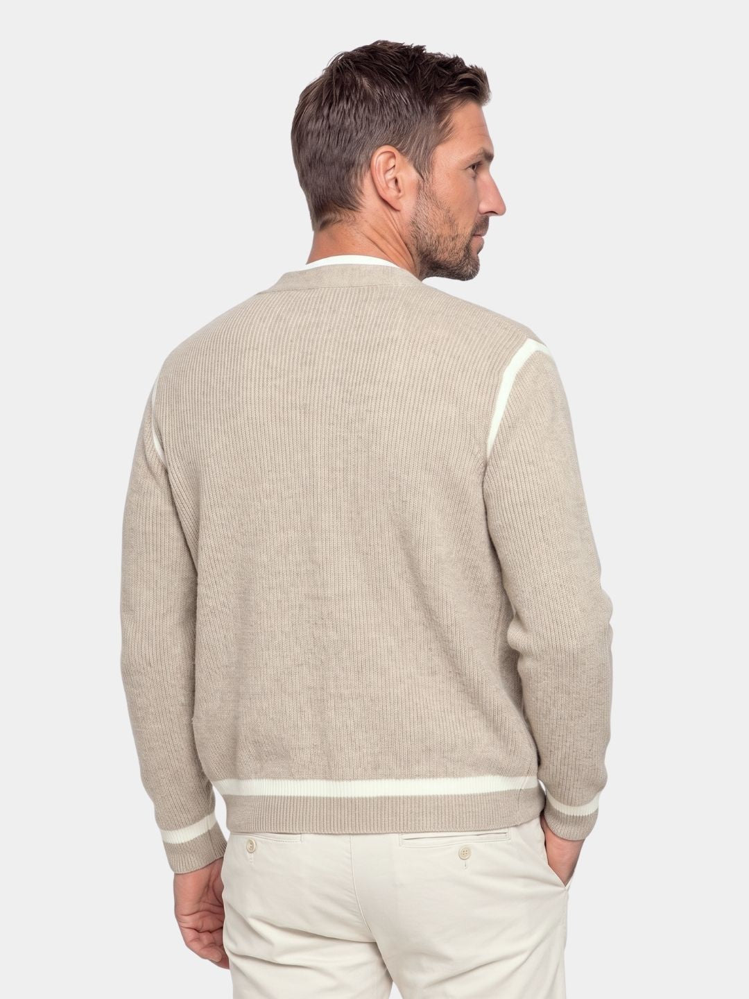 Back view of the beige cardigan showing the striped hem