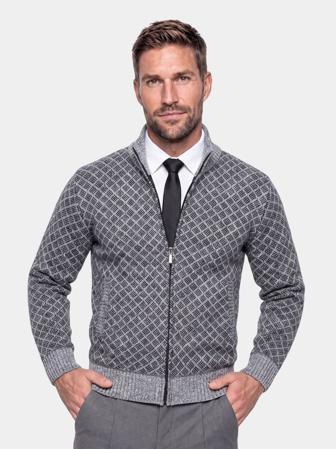 Man wearing the gray jacquard knit zip-up cardigan with a tie
