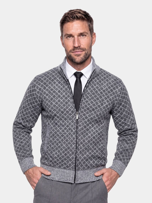 Man wearing the gray jacquard knit zip-up cardigan with a tie