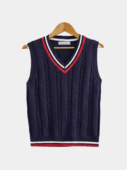 Front view of the navy cable-knit cricket vest with red trim.