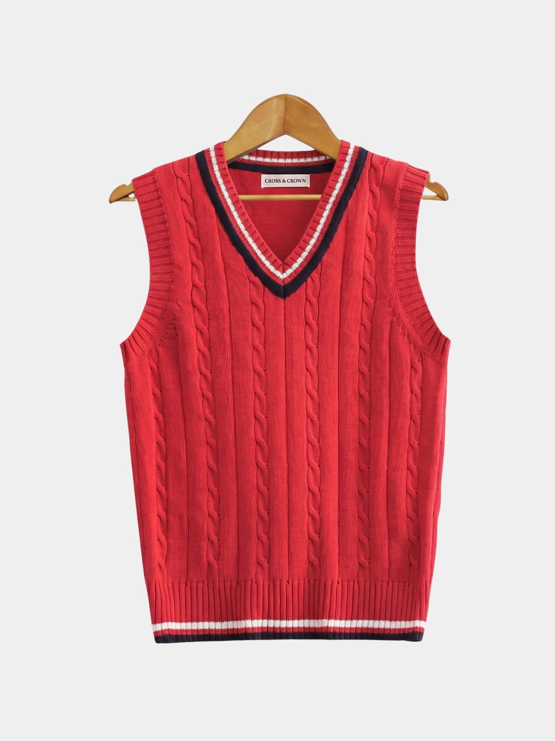 Front view of the red cable-knit cricket vest with navy trim.