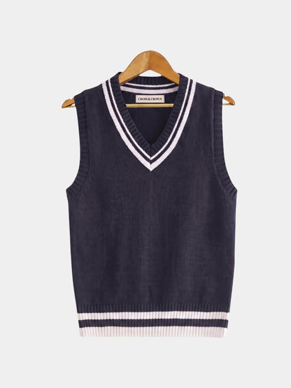 Front view of the navy cable-knit cricket vest with white trim.
