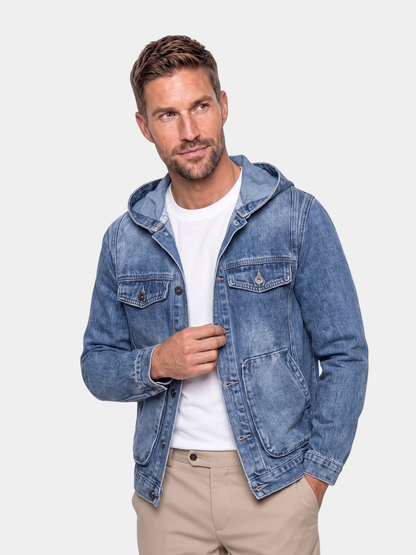 Cross & Crown man wearing the hooded denim jacket open over a white tee