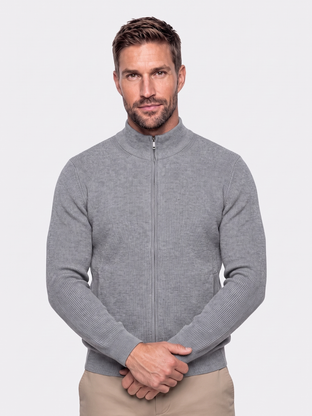 Man wearing a gray ribbed cotton bomber jacket with zip front