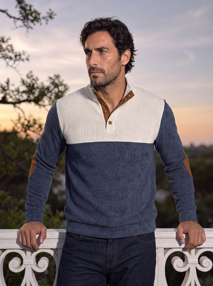 Navy corduroy pullover worn with dark jeans outdoors