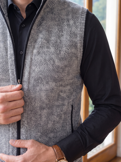 Close-up of the knit texture and zip on the gray sweater vest