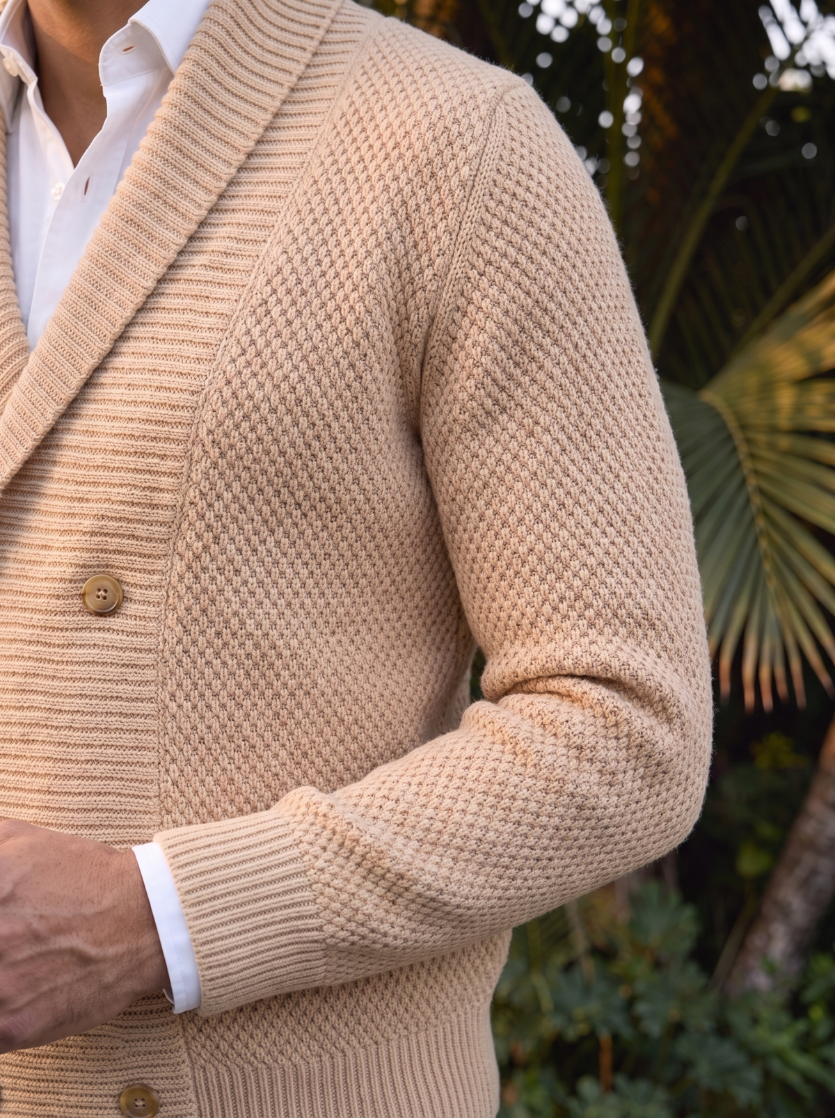 Close-up of the shawl collar and button, beige cardigan
