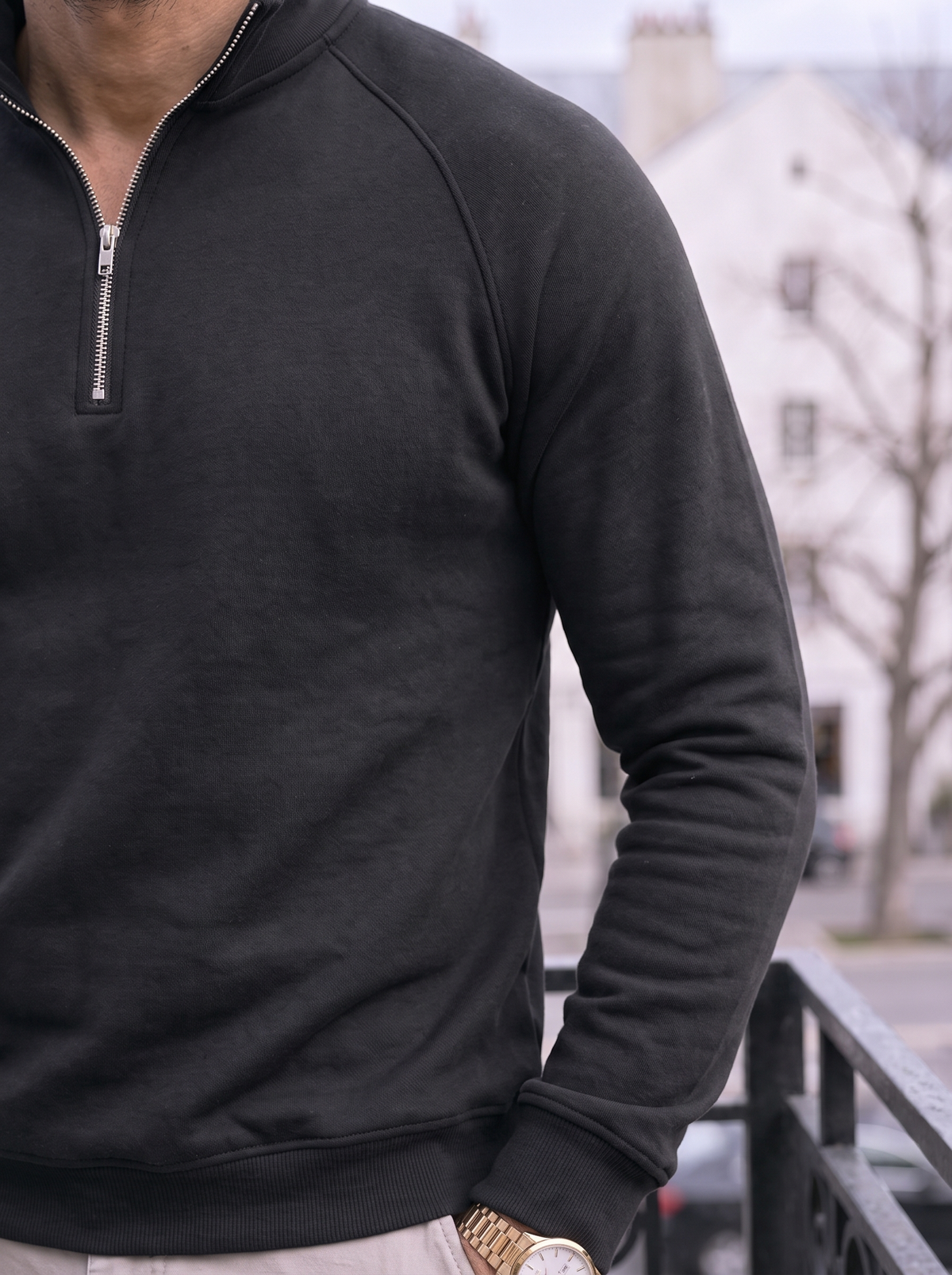 Close-up of the ribbed mock collar and zip pull in black