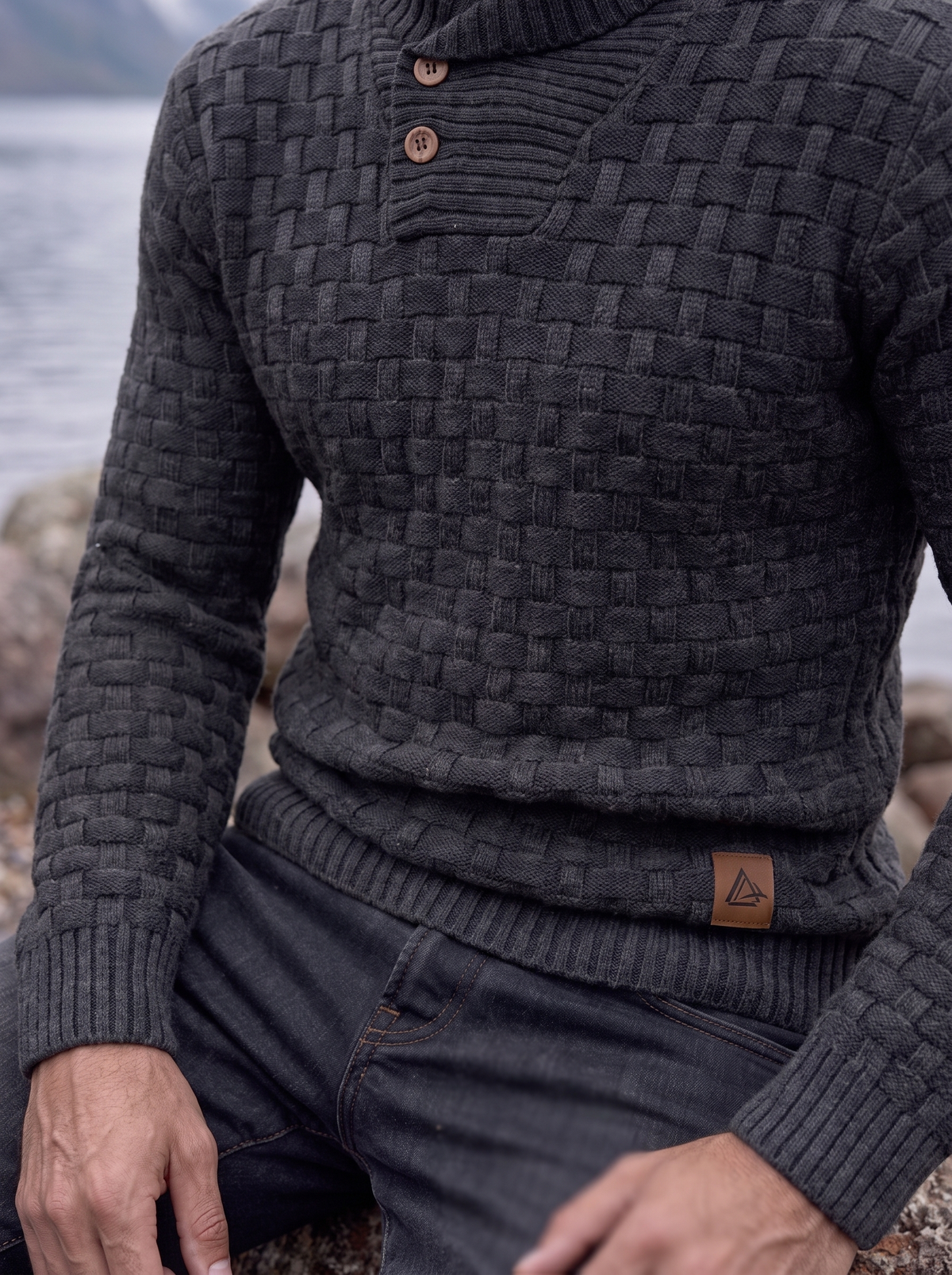 Close-up of the charcoal shawl collar and button placket