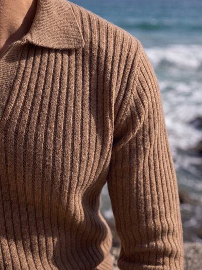 Close-up of the ribbed knit texture and open collar