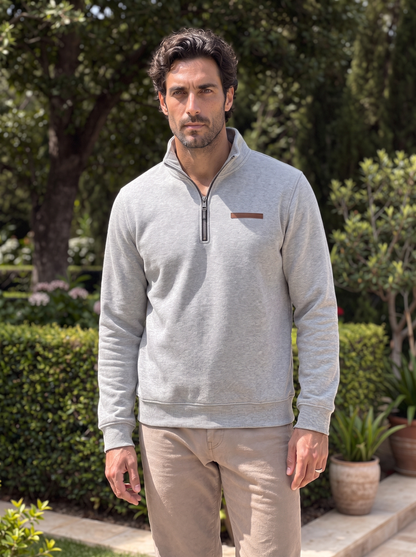 Man wearing the light gray quarter-zip pullover outdoors
