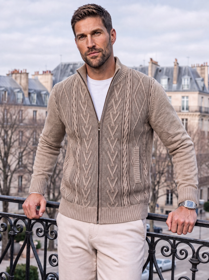 Man wearing the beige full-zip cardigan outdoors on a balcony