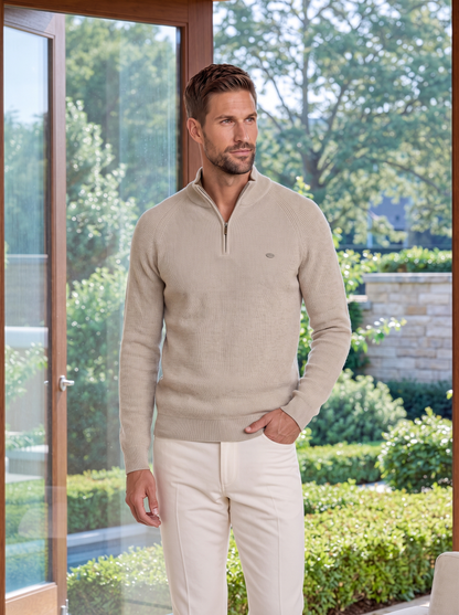 Man wearing the beige ribbed quarter-zip sweater outdoors