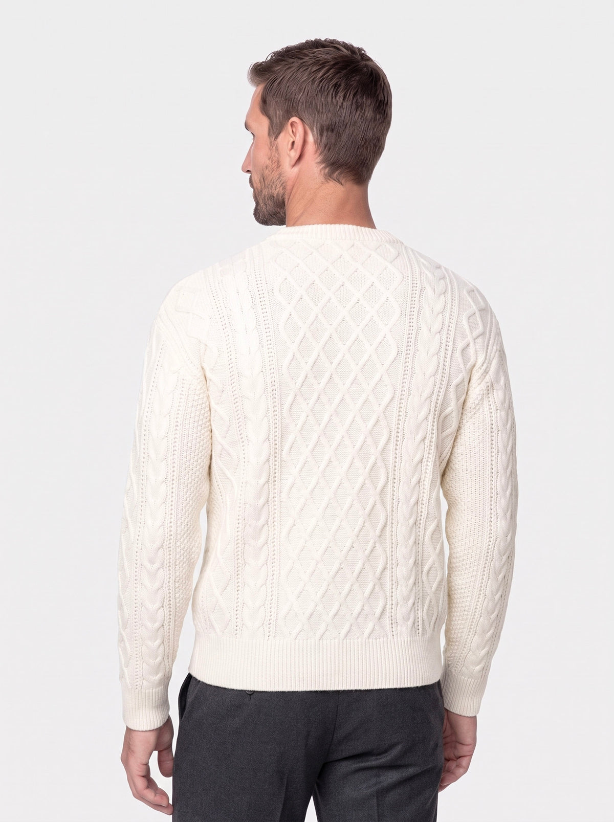 Man in a gray chunky cable-knit crew neck sweater