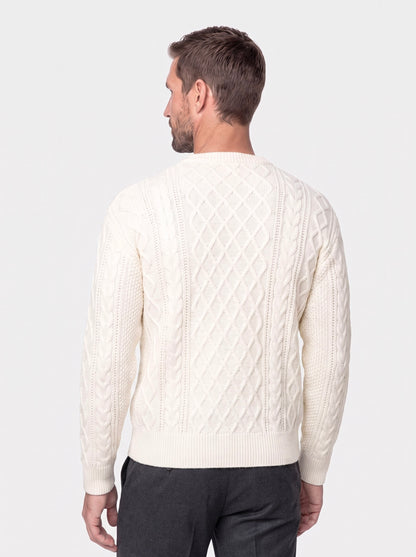 Man in a gray chunky cable-knit crew neck sweater